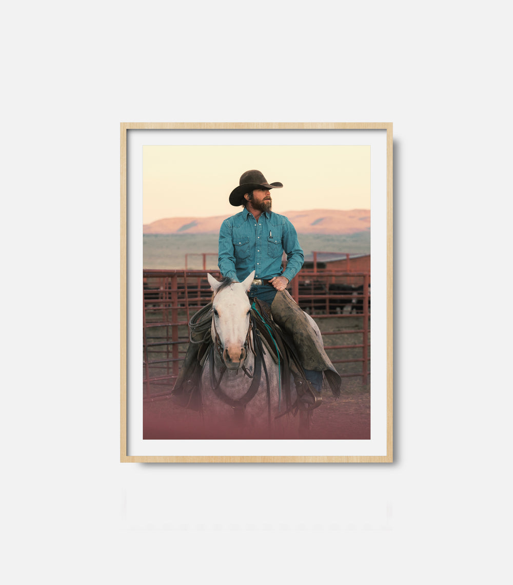 Cowboy wall art print showing man riding horse, rustic statement decor