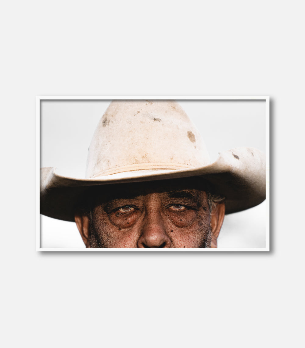 Framed wall art featuring close-up portrait of man in cowboy hat, modern decor