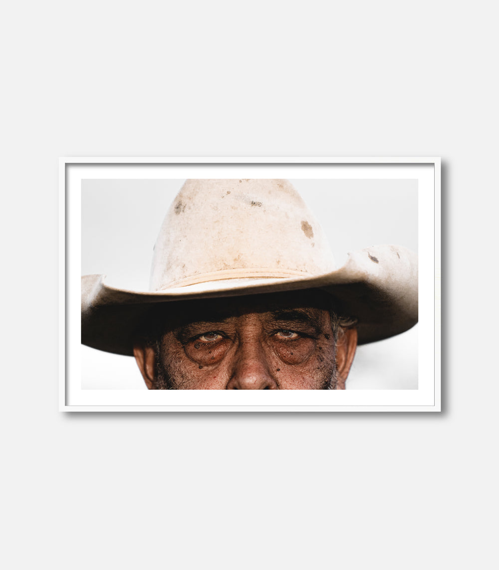 Framed wall art featuring close-up portrait of man in cowboy hat, modern decor