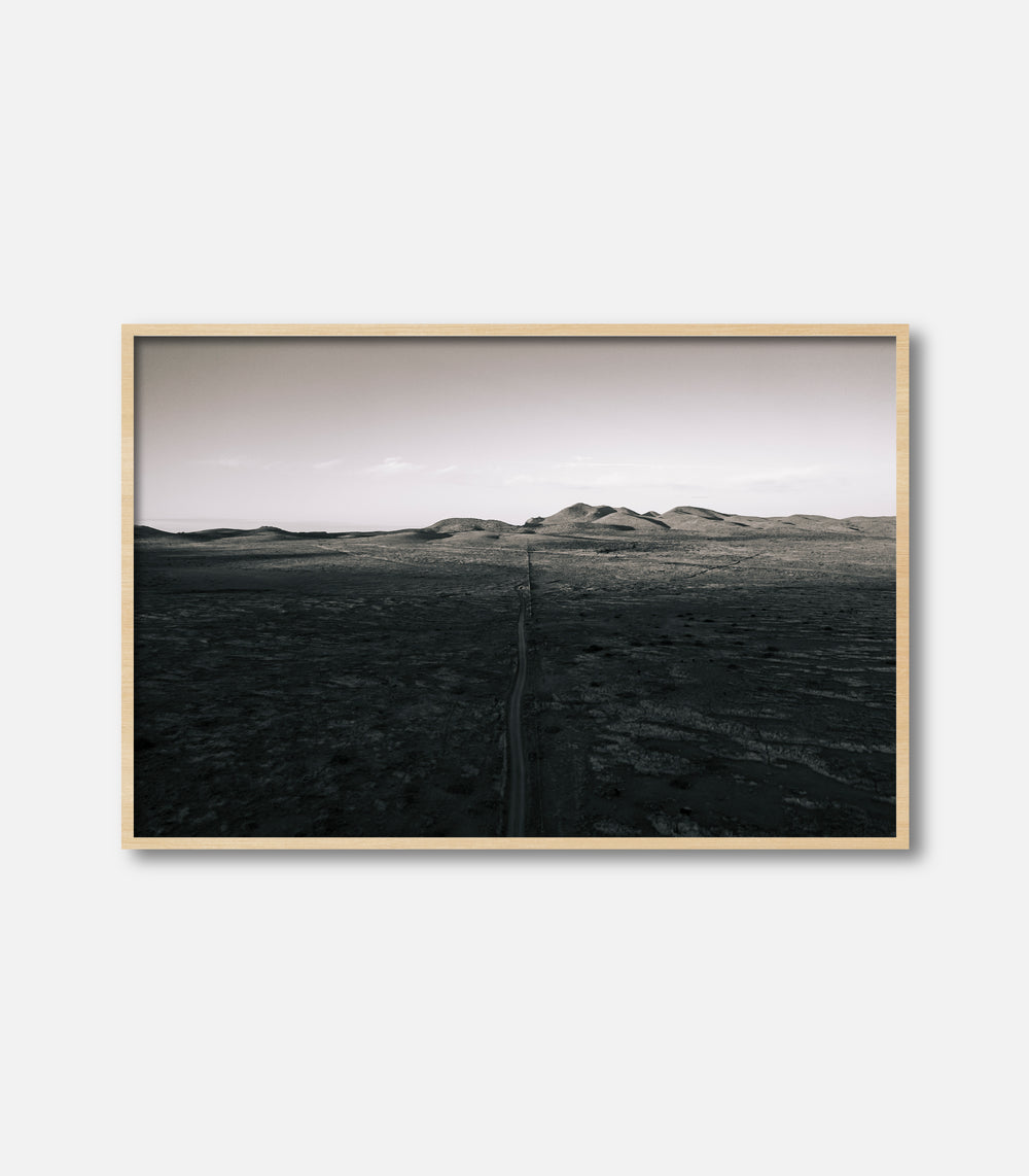 Minimalist monochrome landscape print with open terrain