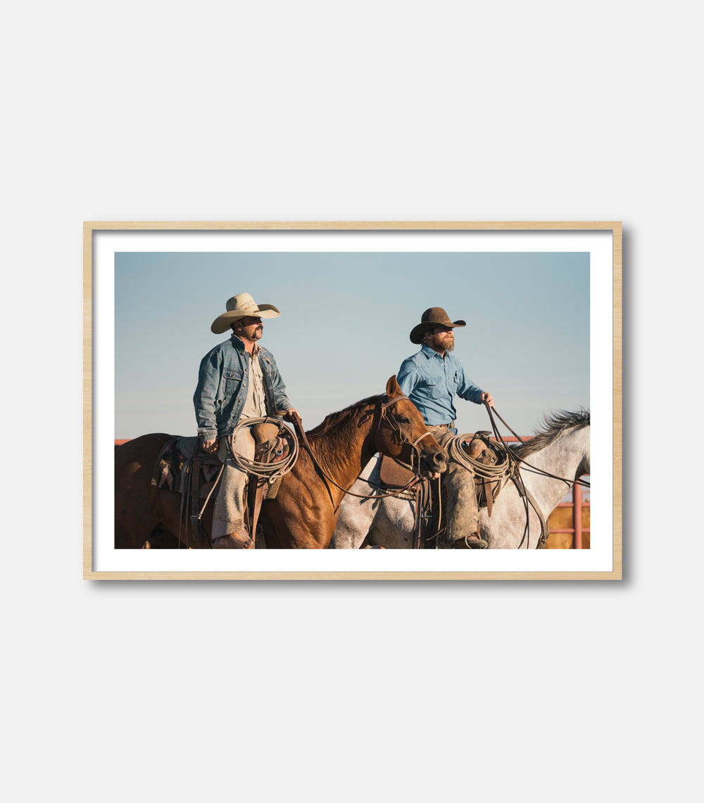Cowboy wall art print showing two riders on horseback, rustic interior statement piece
